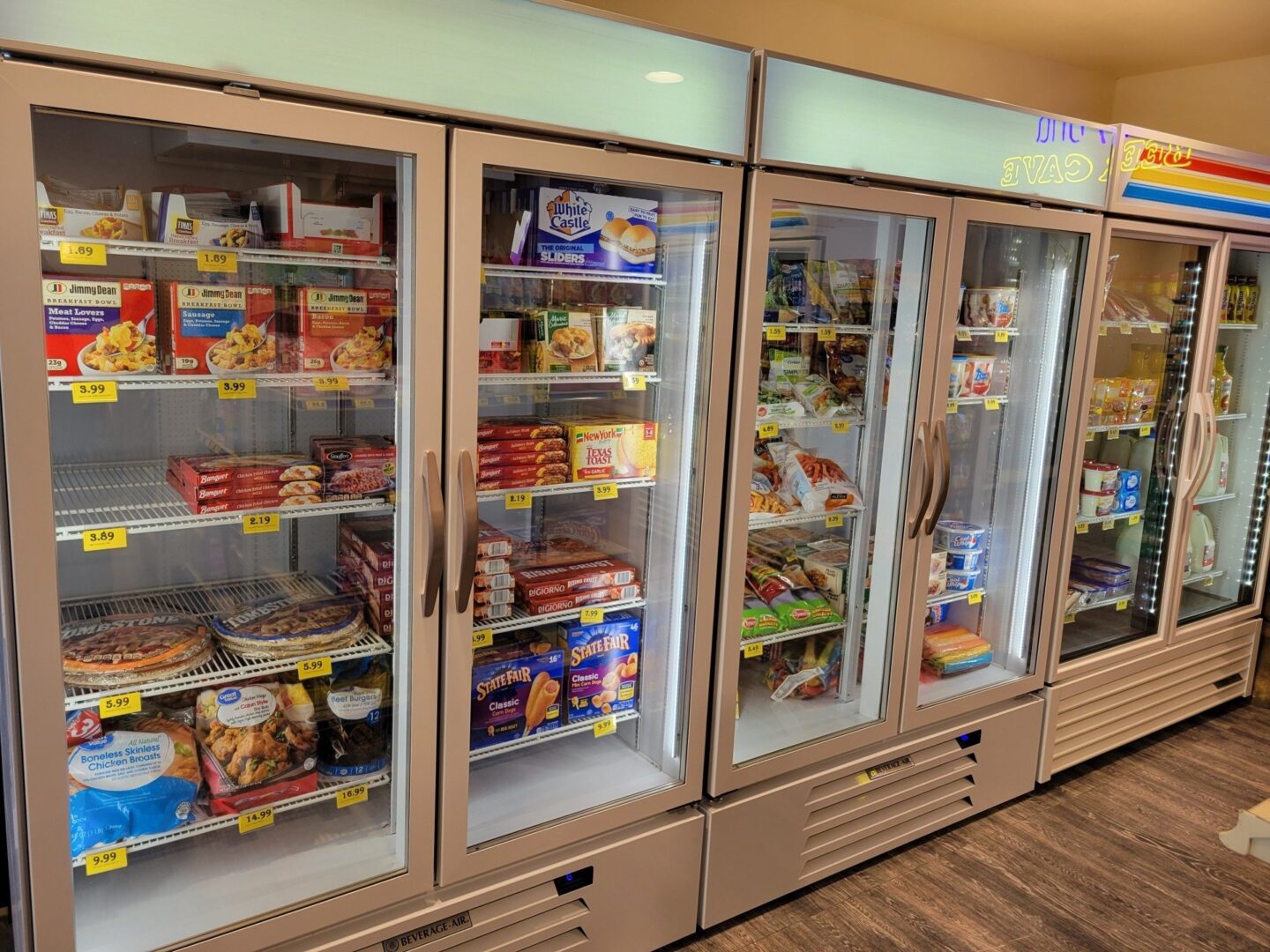 A large display freezer filled with lots of food.