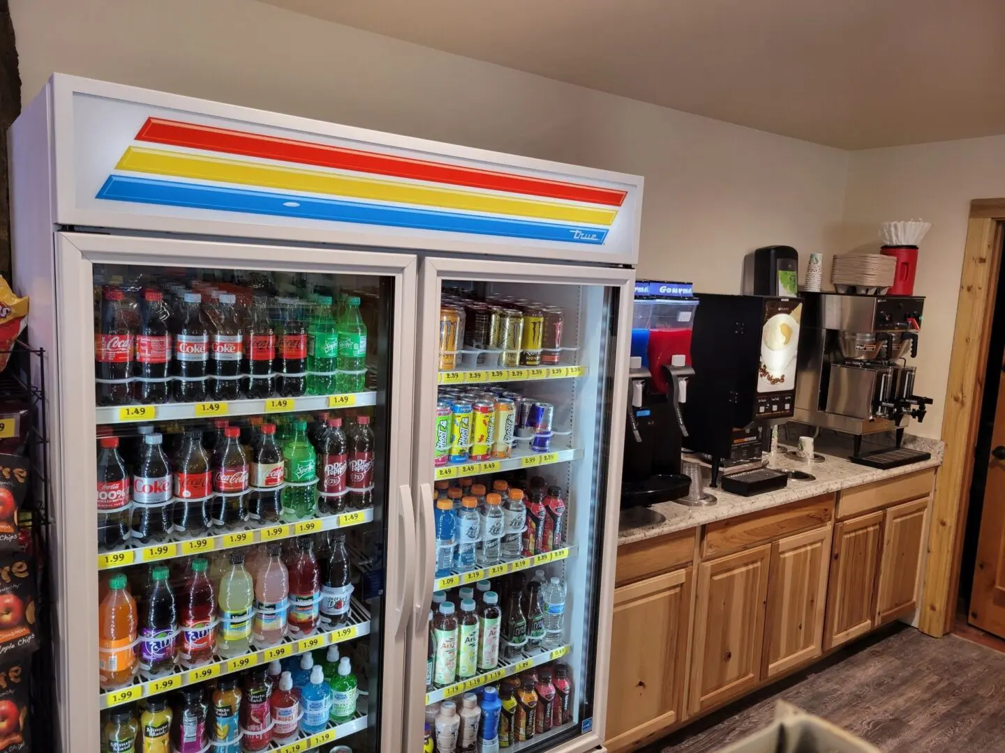 A large refrigerator with many drinks on it